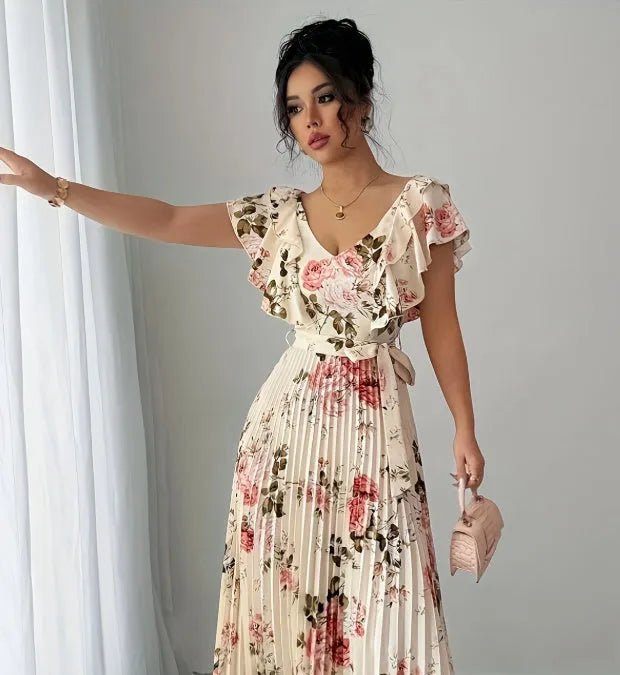 Apricot floral print V-neck dress with ruffled short sleeves and a long, flowing swing skirt.