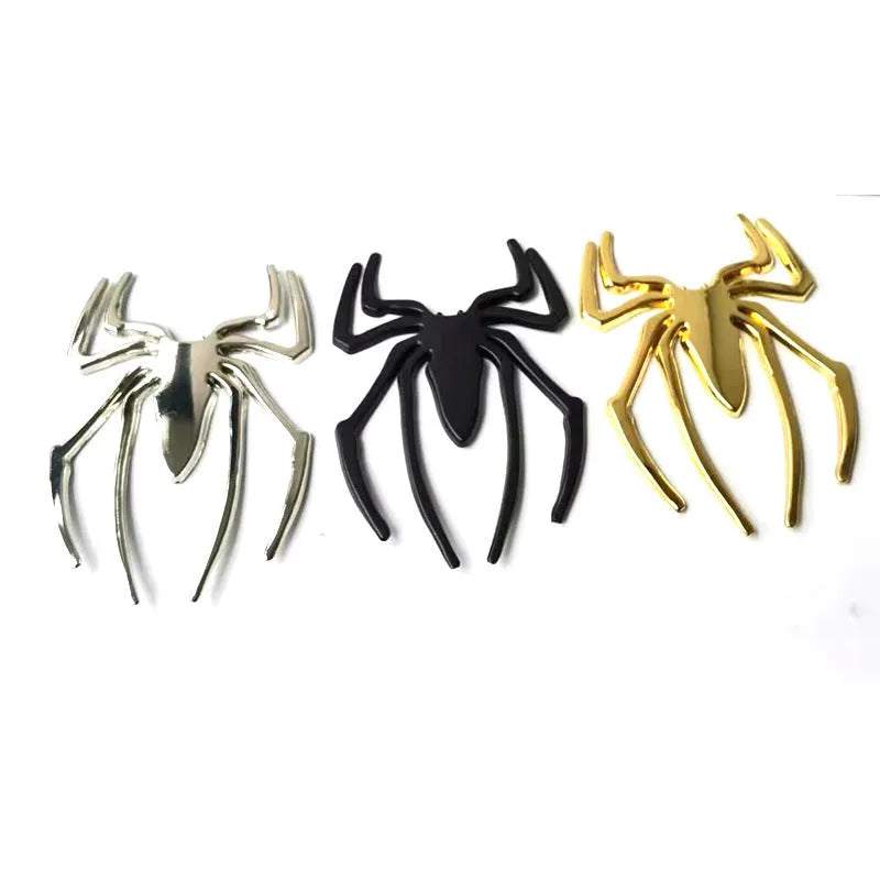 Three-dimensional metal spider bumper sticker in zinc alloy on a car bumper.