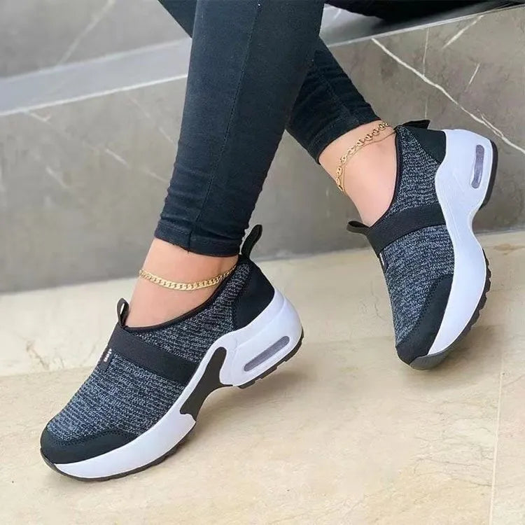 Women's lightweight flat mesh sneakers in multiple colours with a rubber sole, shown from the side.