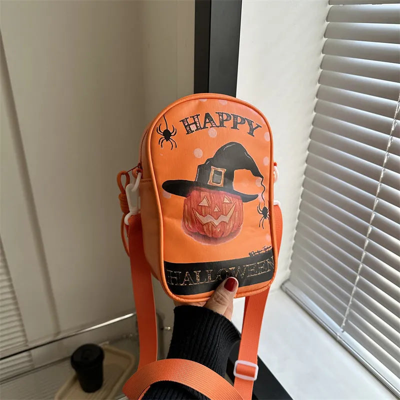 Halloween graffiti crossbody phone bag with cartoon pumpkin, ghost, and bat print in black.