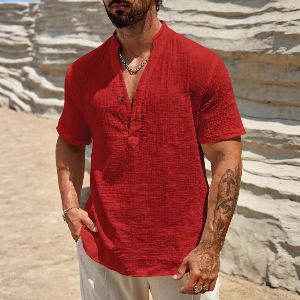 Man wearing a light blue short-sleeved stand collar shirt made from thin polyester blend fabric