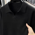 Men's loose fit casual pullover sweater in green, shown on a model, suitable for autumn leisure wear.