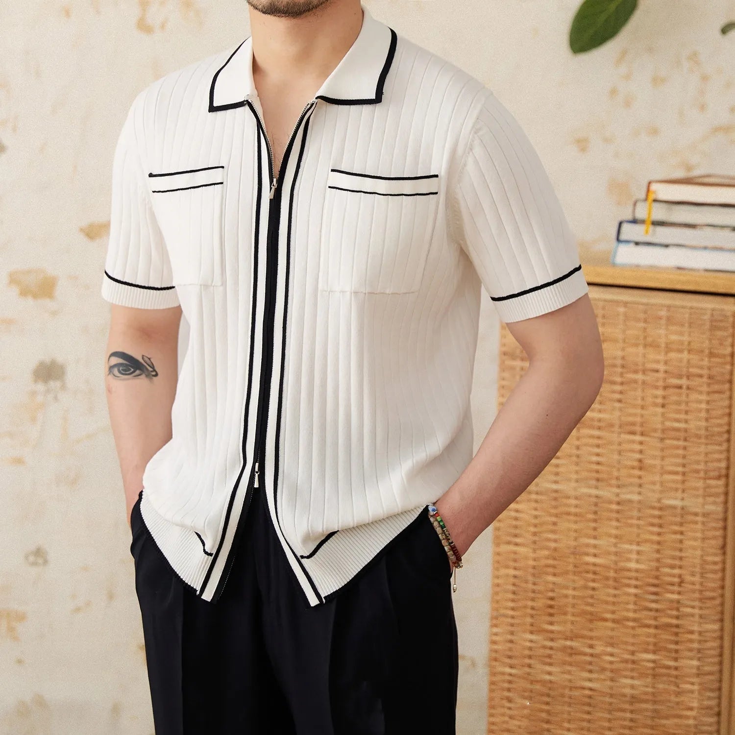 Men's black slim fit short sleeve polo shirt with lapel collar on hanger