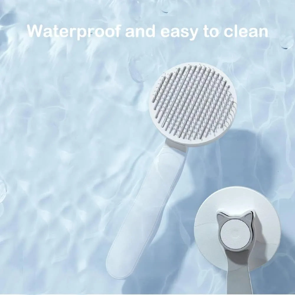 Blue self-cleaning cat grooming brush with rubber handle and metal pins, shown removing fur.
