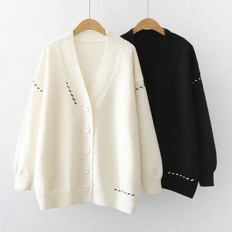 Women's loose fit long sleeve knitted cardigan coat in black or white
