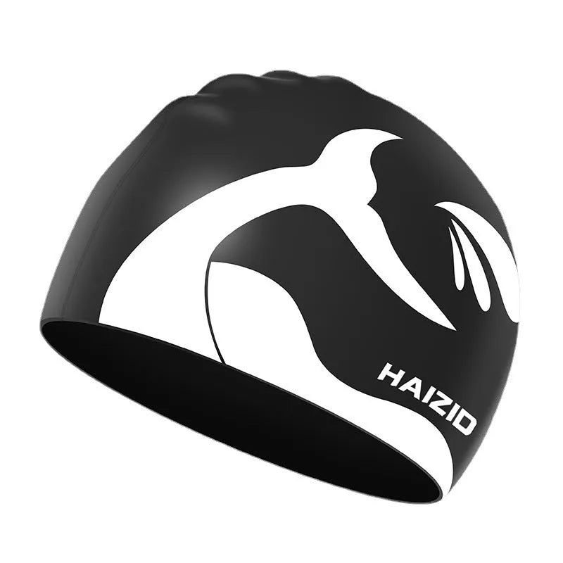Adult unisex silicone swim cap with whale tail pattern and built-in ear protectors in four colours.