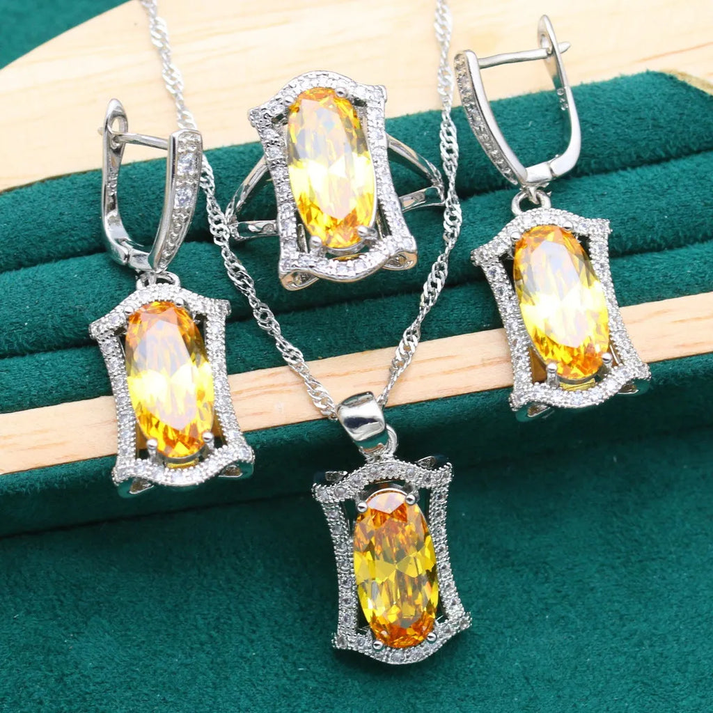 Women's olive yellow zirconia anti-allergy alloy jewellery set with necklace, earrings, ring, and bracelet.
