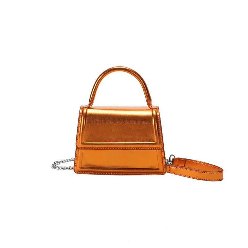 Retro shoulder bag with horizontal square shape in silver colour showing sewing line details
