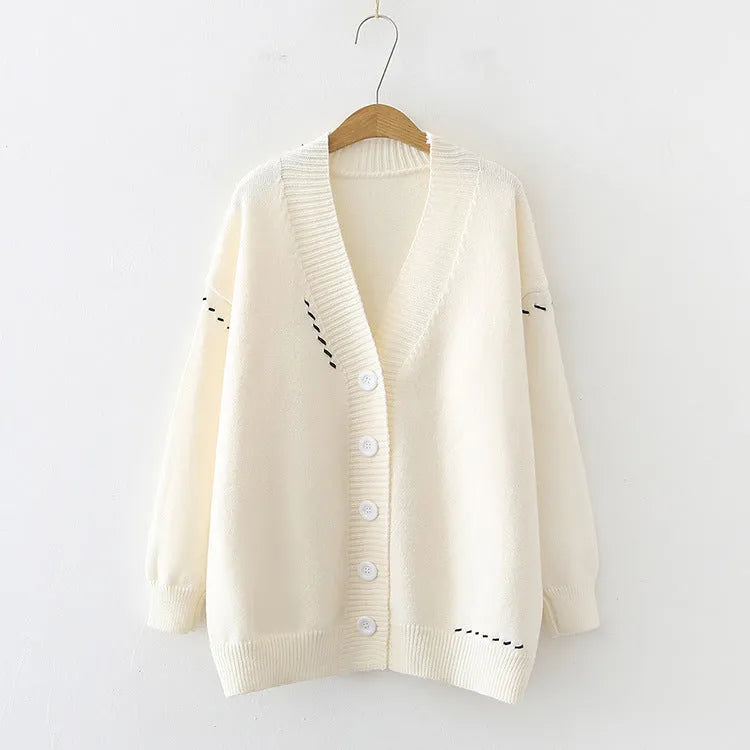 Women's loose fit long sleeve knitted cardigan coat in black or white