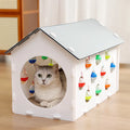 Plastic cat scratch board integrated with nest area, tunnel and bell ball toy components