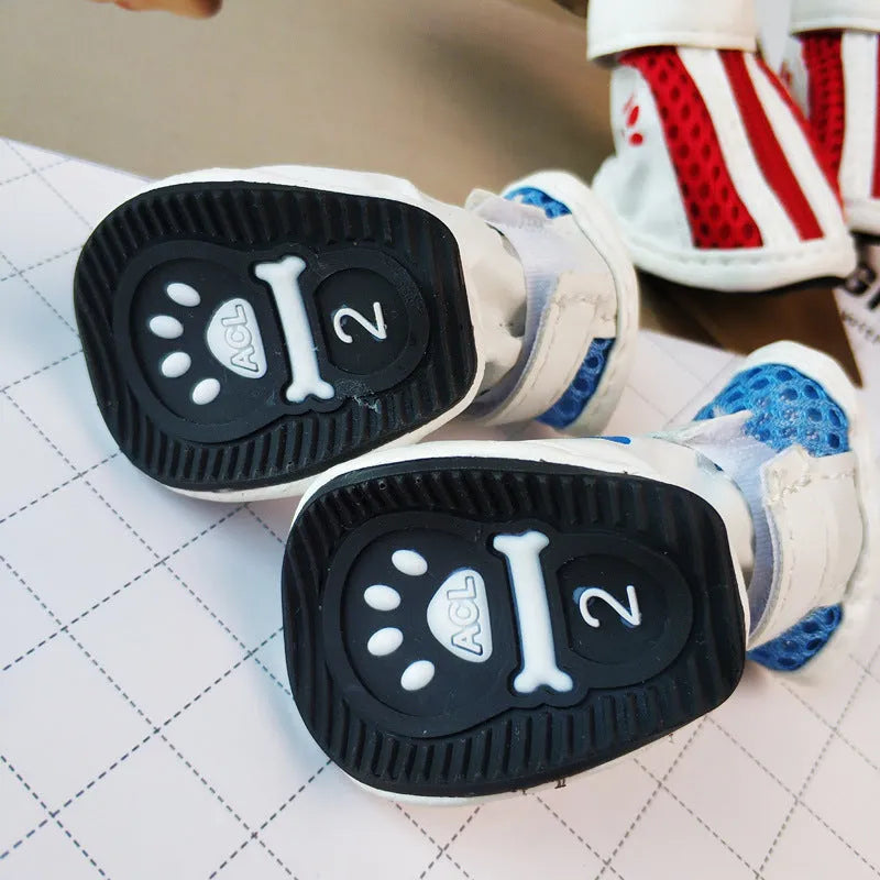 Set of four blue VIP Teddy Schnauzer zipper dog shoes for small dogs on a white background.
