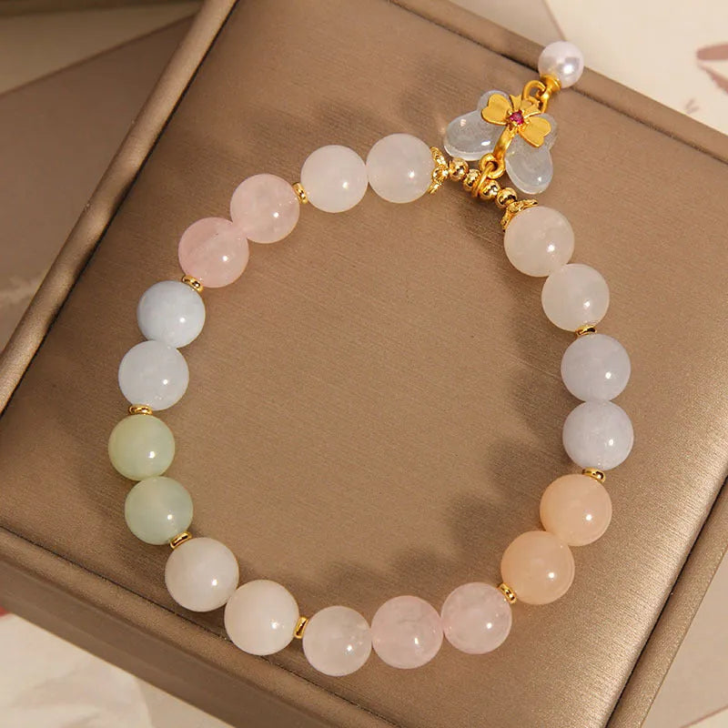 Women's crystal bracelet with natural Morganite butterfly pendant in colourful gemstone tones.