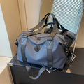Waterproof Oxford cloth travel bag in solid colour with breathable back panel and 36-55L capacity
