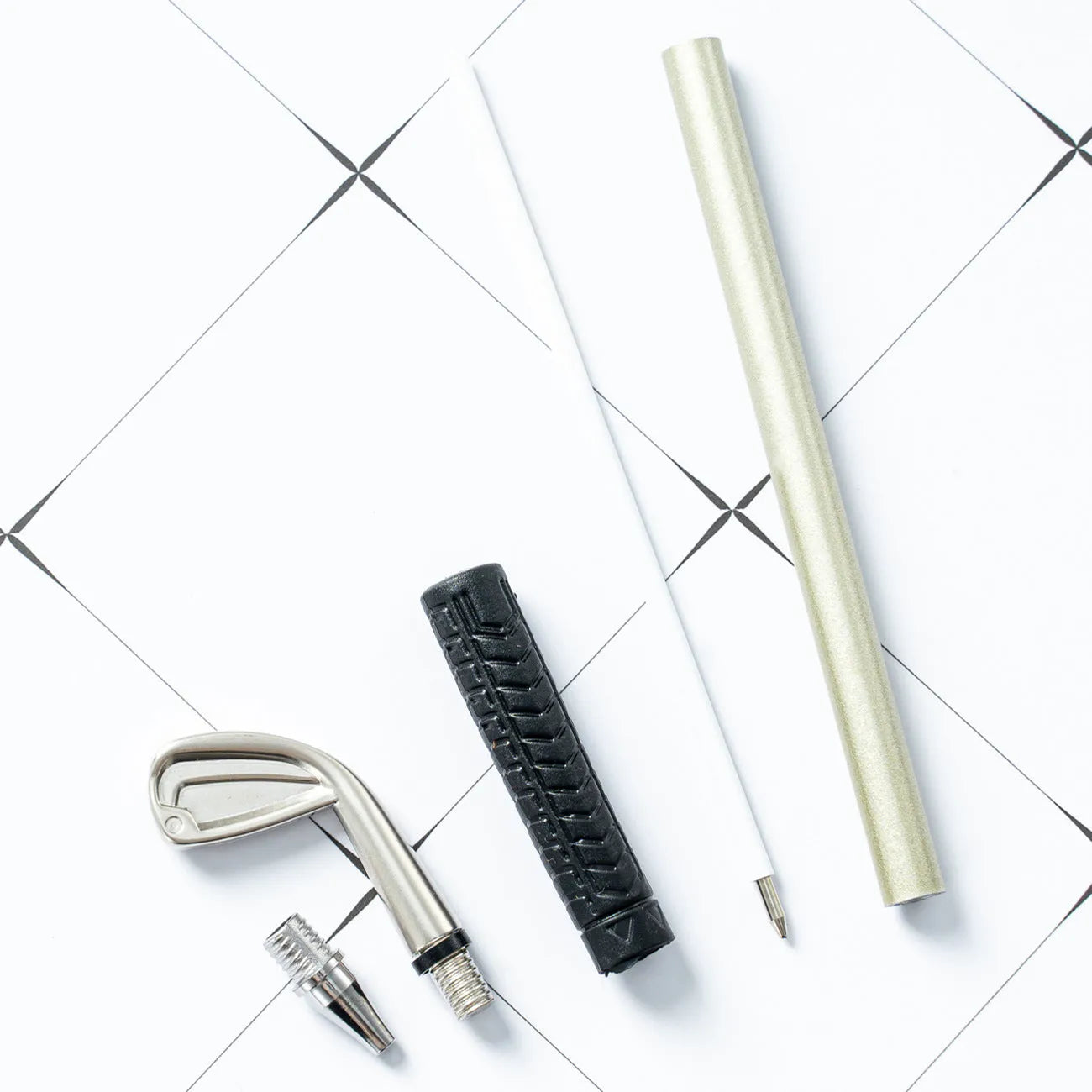 Three metal ballpoint pens with golf suit design showing 0.7mm bullet-type pen heads