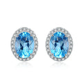 Geometric 925 sterling silver jewellery set with blue topaz stones, showing earrings, ring, pendant and necklace.