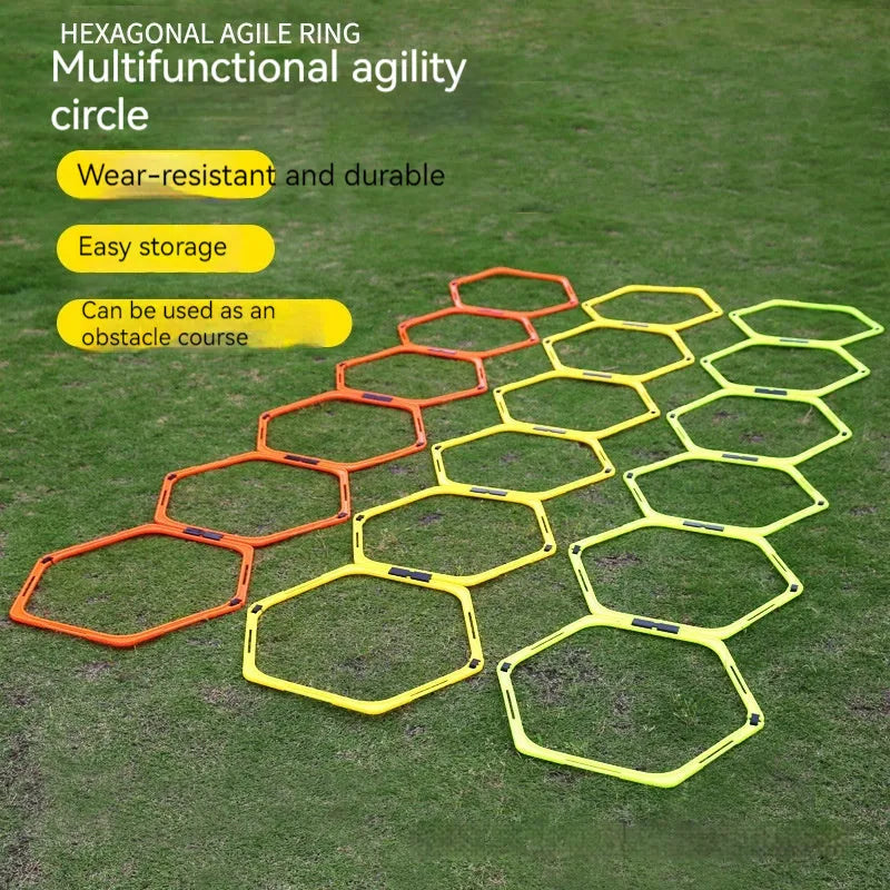 Set of six bright green, orange, and yellow foldable hexagon football agility training rings laid out on grass.
