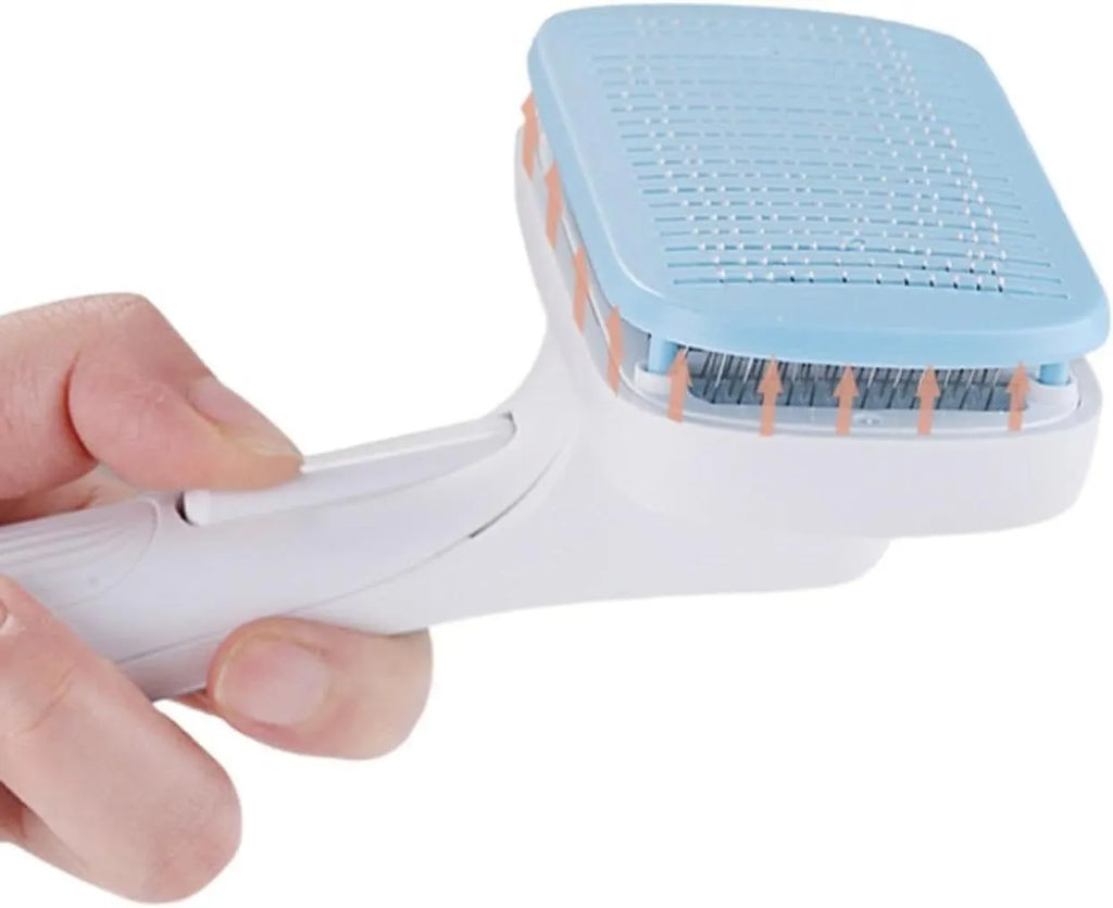 Blue automatic pet hair removal comb on a table, showing its size and one-click button.