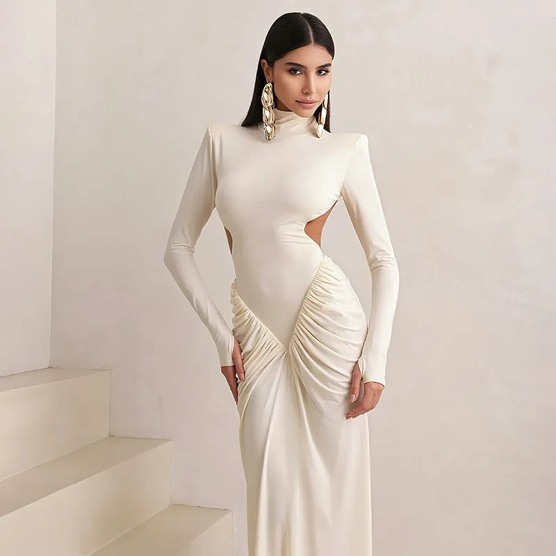 Women's slim fit long sleeve dress with high collar and pleated backless detail in a solid colour.