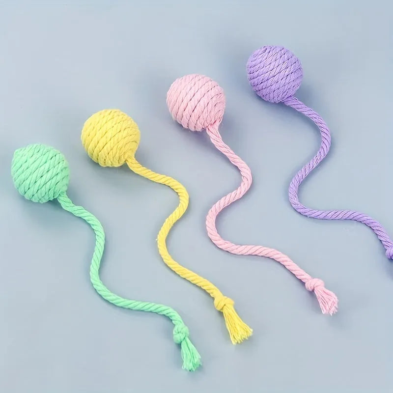Cat toy ball with rope and bell inside in green, pink, purple, and yellow colours