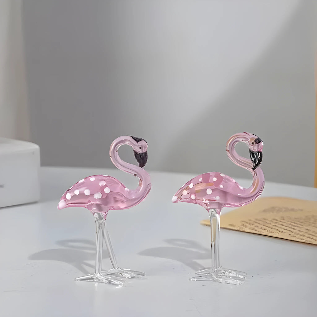 Pink crystal flamingo decorative ornament on a table, modern minimalist style.