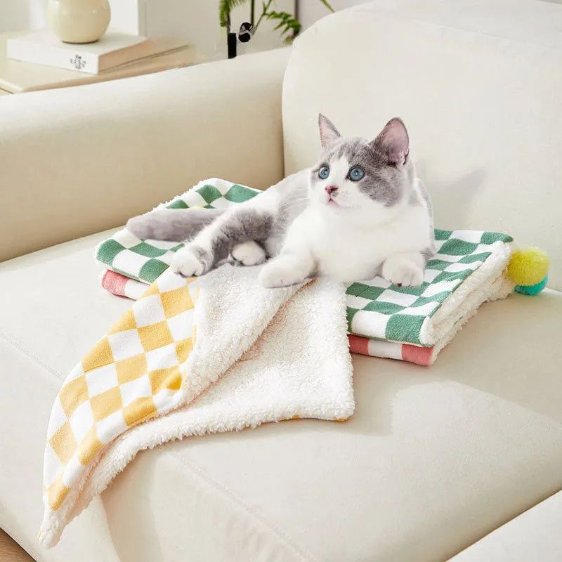 Green plaid pattern pet blanket with decorative fur balls for cats and dogs