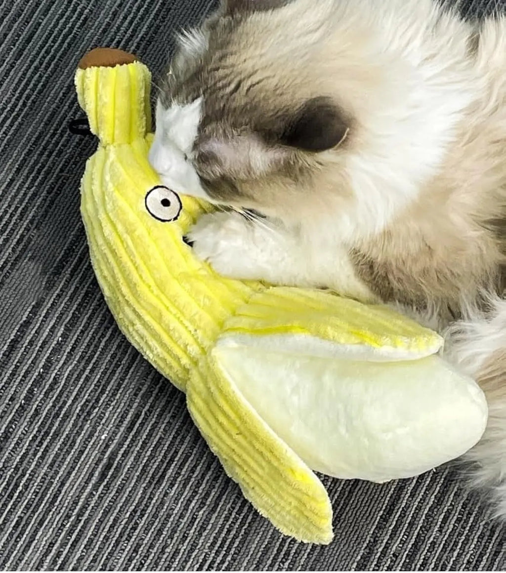 Yellow banana-shaped cat toy with plush fabric and crinkle paper inside.