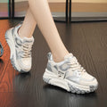 Women's leather sports casual shoes with thick sole and lace-up front in black and white colour.