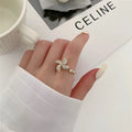 Rotating geometric ring with spinning windmill design in gold or silver electroplated finish