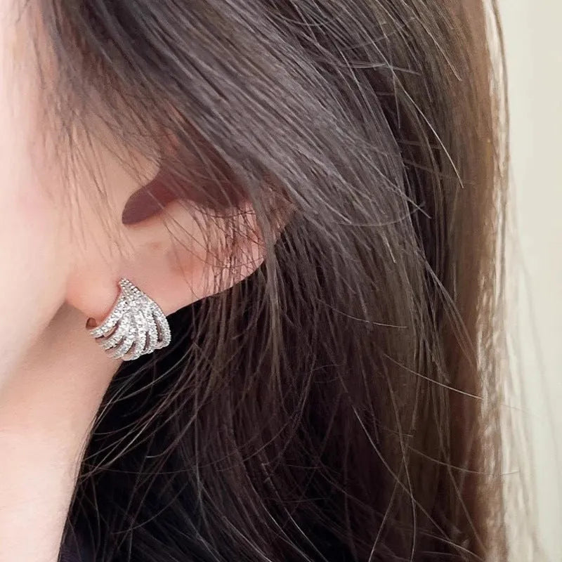 Geometric zircon earrings with platinum electroplated finish and line design details