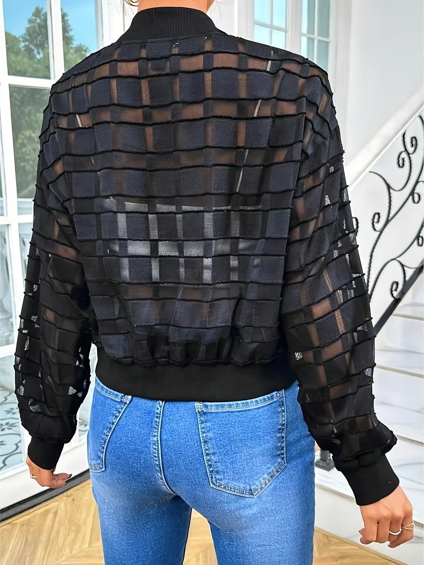 Black women's casual jacket with geometric pattern, front zipper, and long sleeves