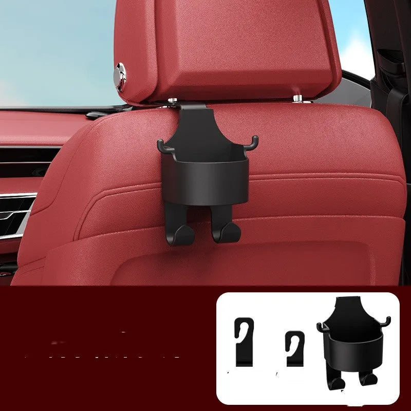 Black plastic car hook seat back organiser with cup holder mounted on vehicle headrest