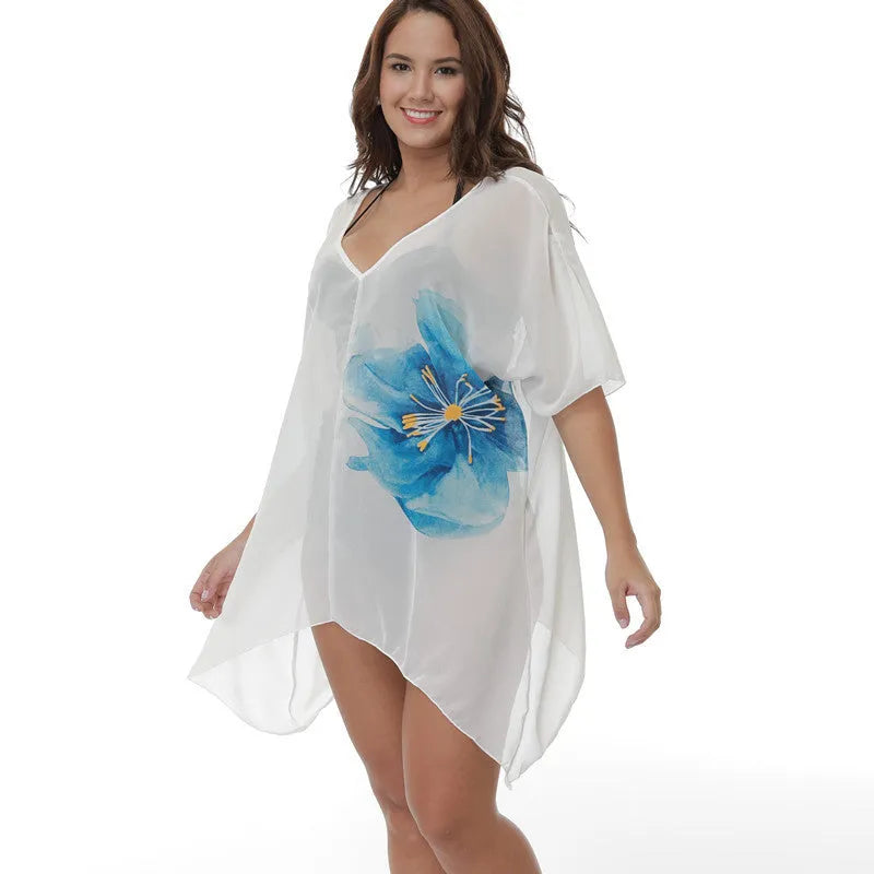 White loose-fit plus size beach cover-up blouse on a hanger.