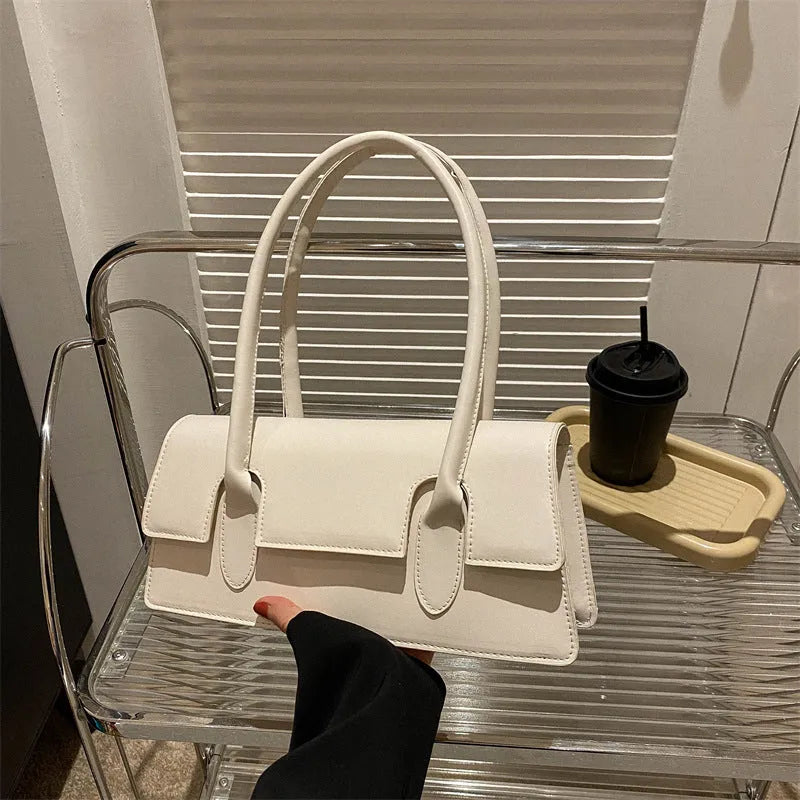 Women's small horizontal square shoulder bag in PU leather with stitching details