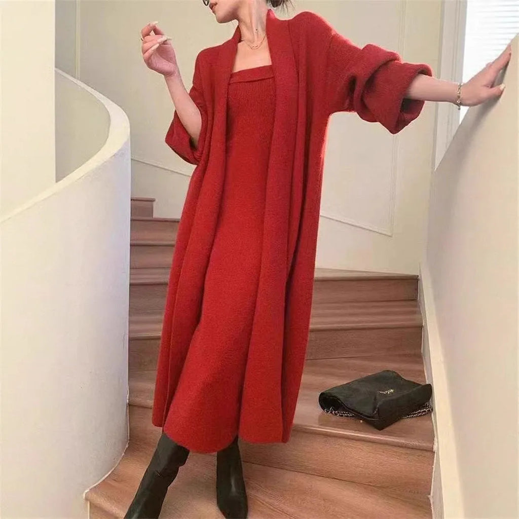 Women's grey knitted cardigan dress and coat suit set with long skirt and flocking detail.