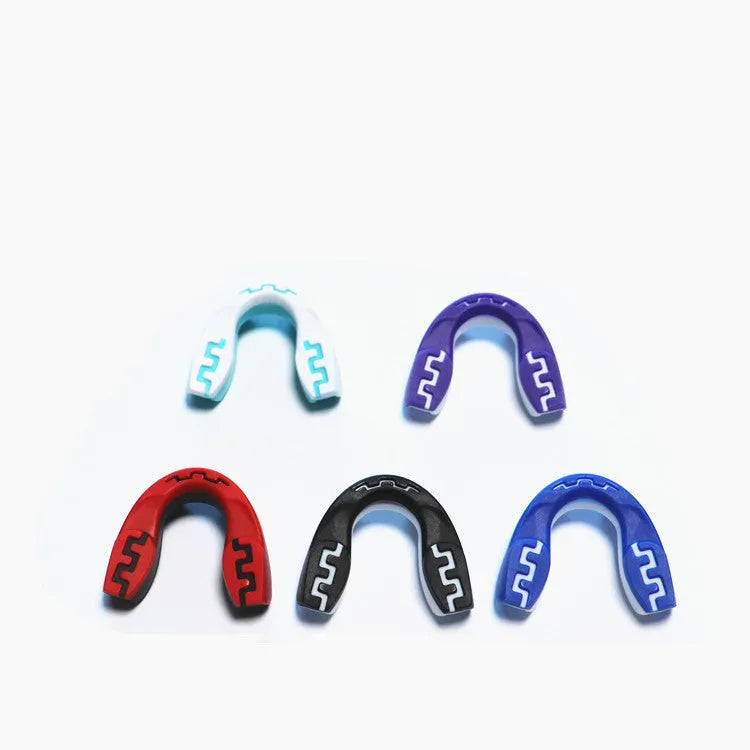 Adult boxing sports mouthguard with tooth socket free design in black and white printed teeth pattern.