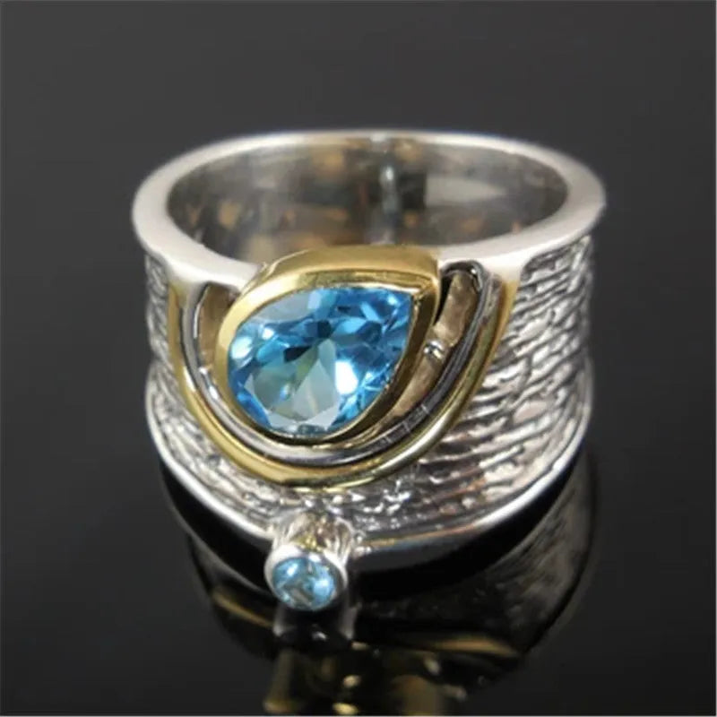 Blue Chinese style zircon ring with drop shape design and inlaid rhinestone detailing on alloy band