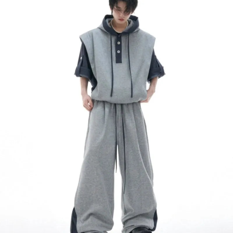 Men's black hooded short sleeve sportswear jacket and trousers set with three-dimensional stitching detail.