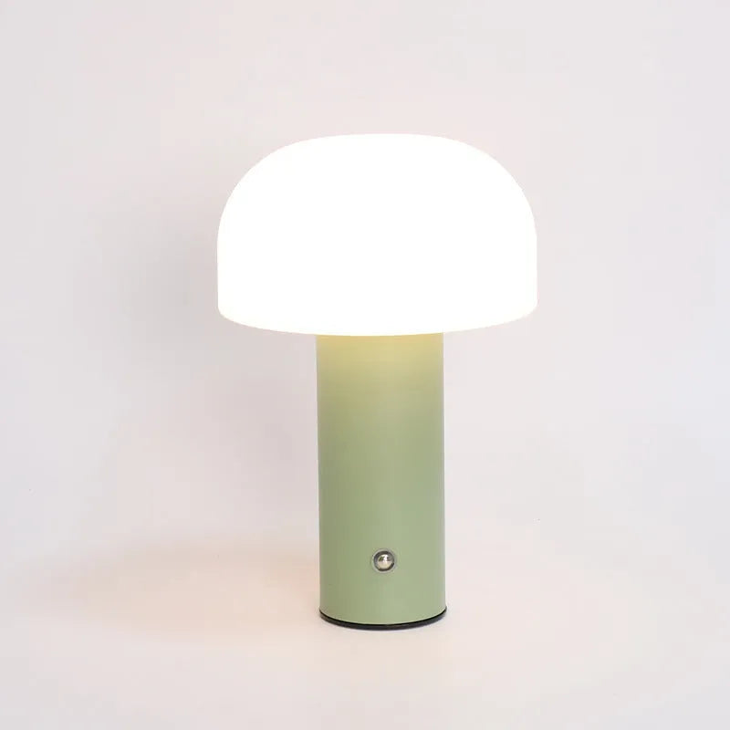 Plastic USB table lamp in black, green, orange, or white on a desk surface.