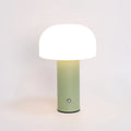 Plastic USB table lamp in black, green, orange, or white on a desk surface.