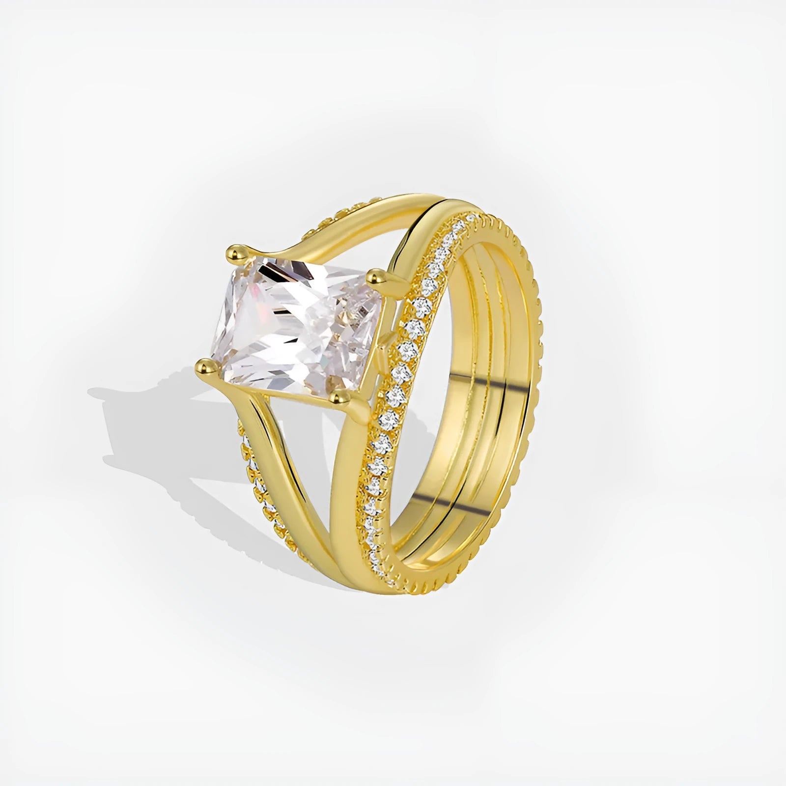 Geometric gold-coloured women's ring with a square zircon stone, shown in size options 6 to 9.