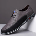 Men's black leather toe cap casual shoes with a rubber sole and sewing line detail on the fabric upper.