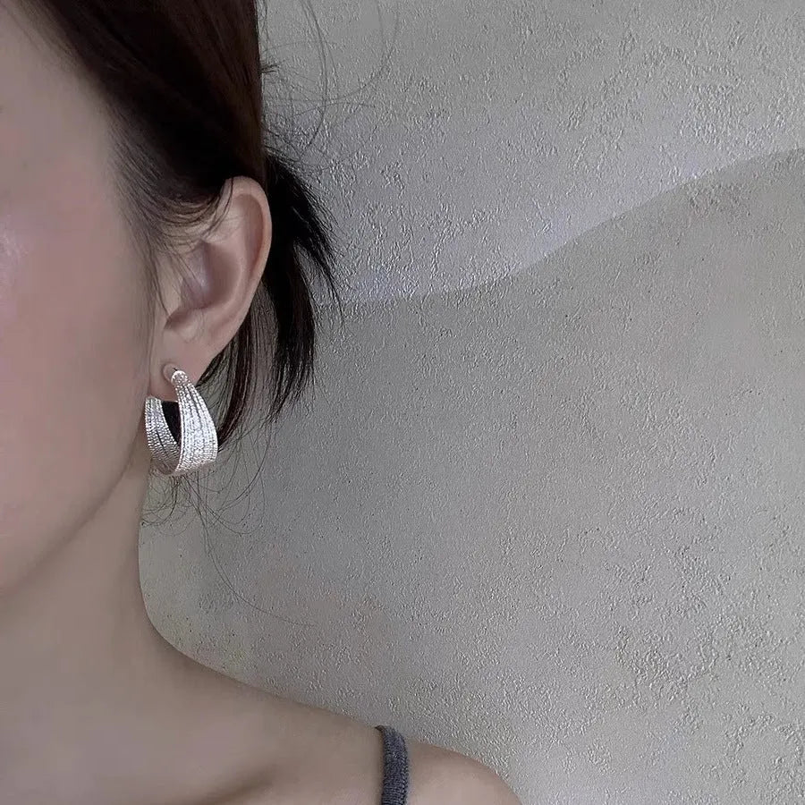 Multi-layer geometric earrings in gold and silver with stud and clip style options