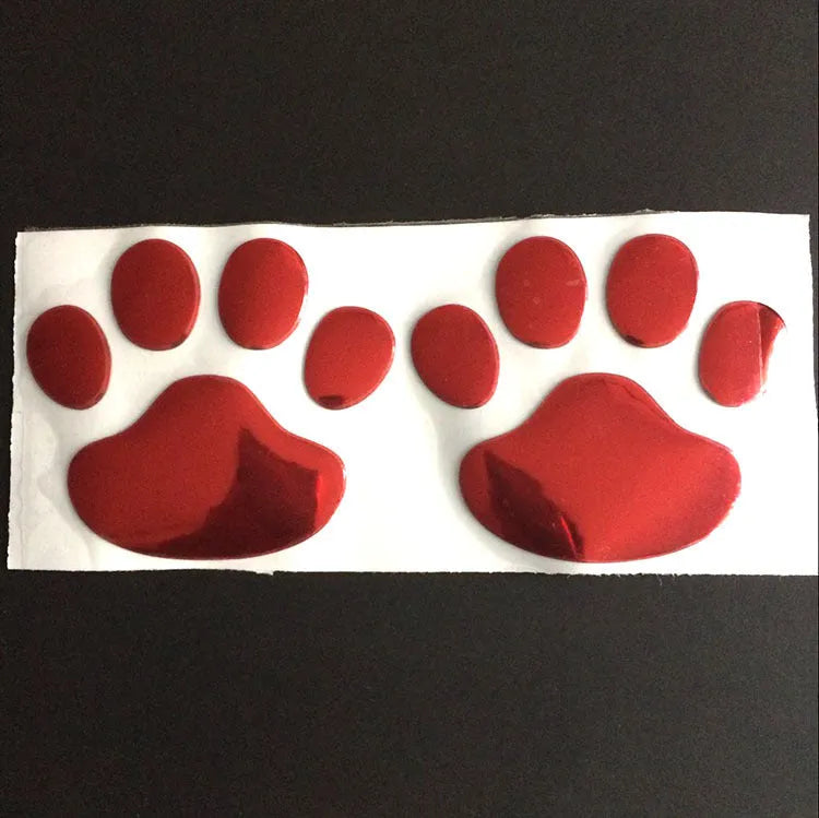 PVC car stickers showing hand-shaped brush design with dog footprints pattern in four colour options