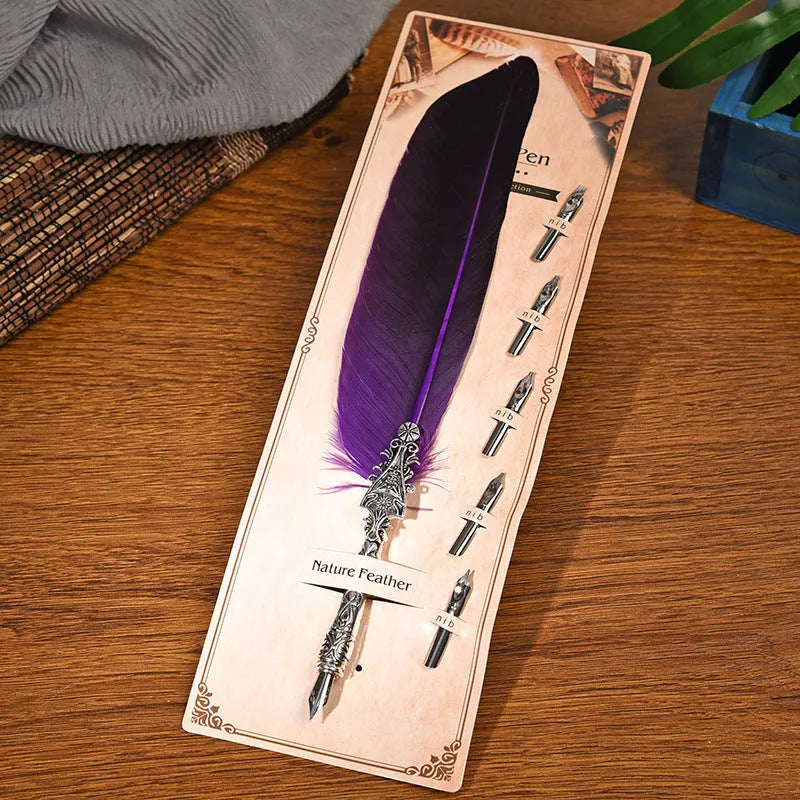 Vintage feather dip pen with zinc alloy shell in various colour options on a desk.