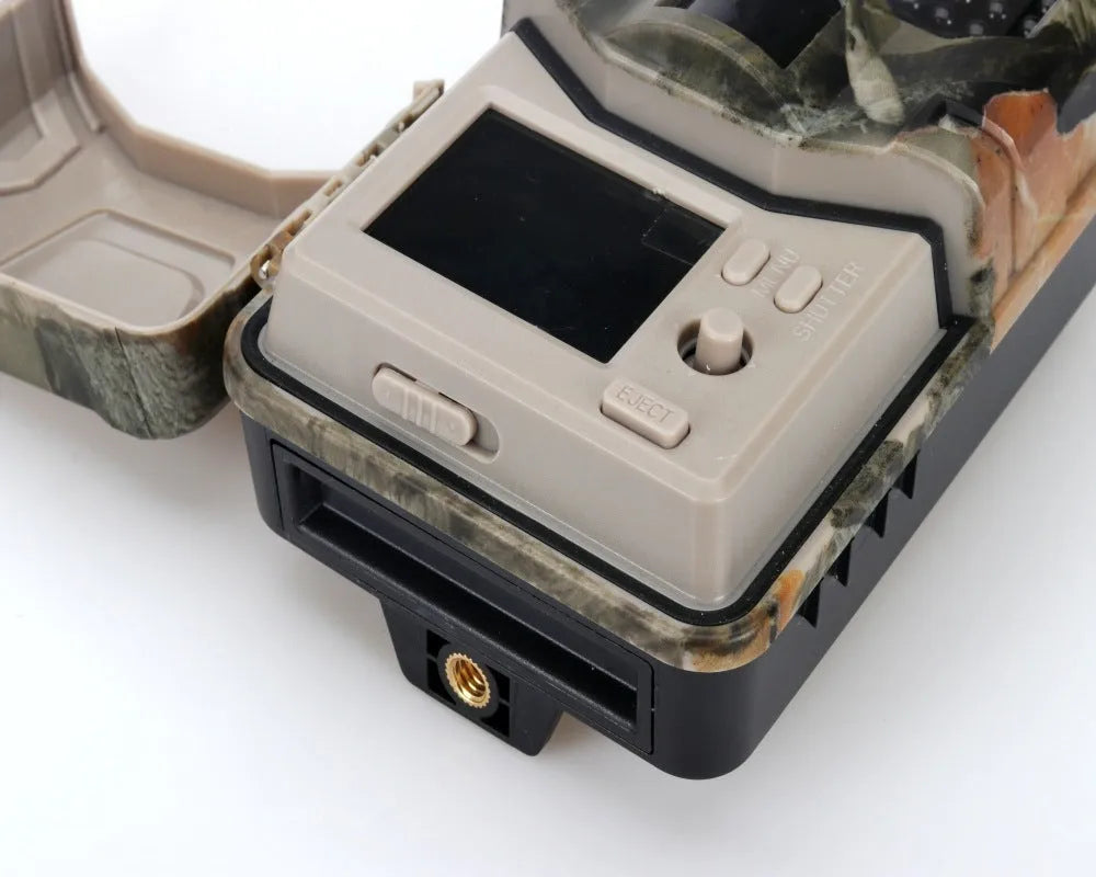 Compact camouflage outdoor hunting camera with infrared LEDs and lens