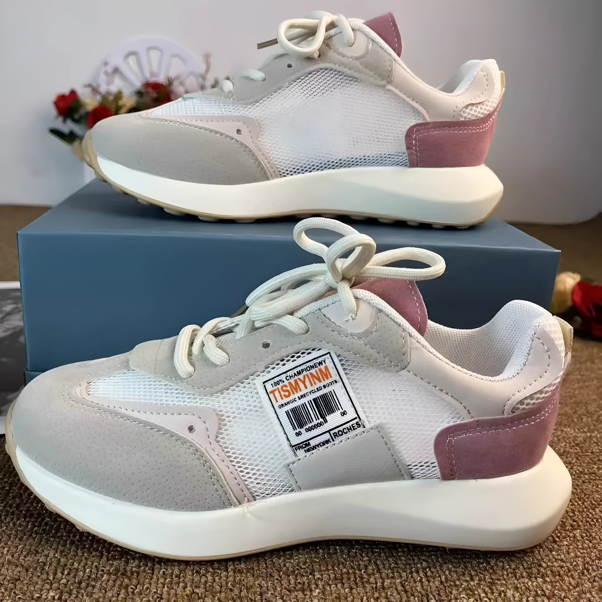 Women's casual retro sneaker in grey or pink with low-top design and round toe