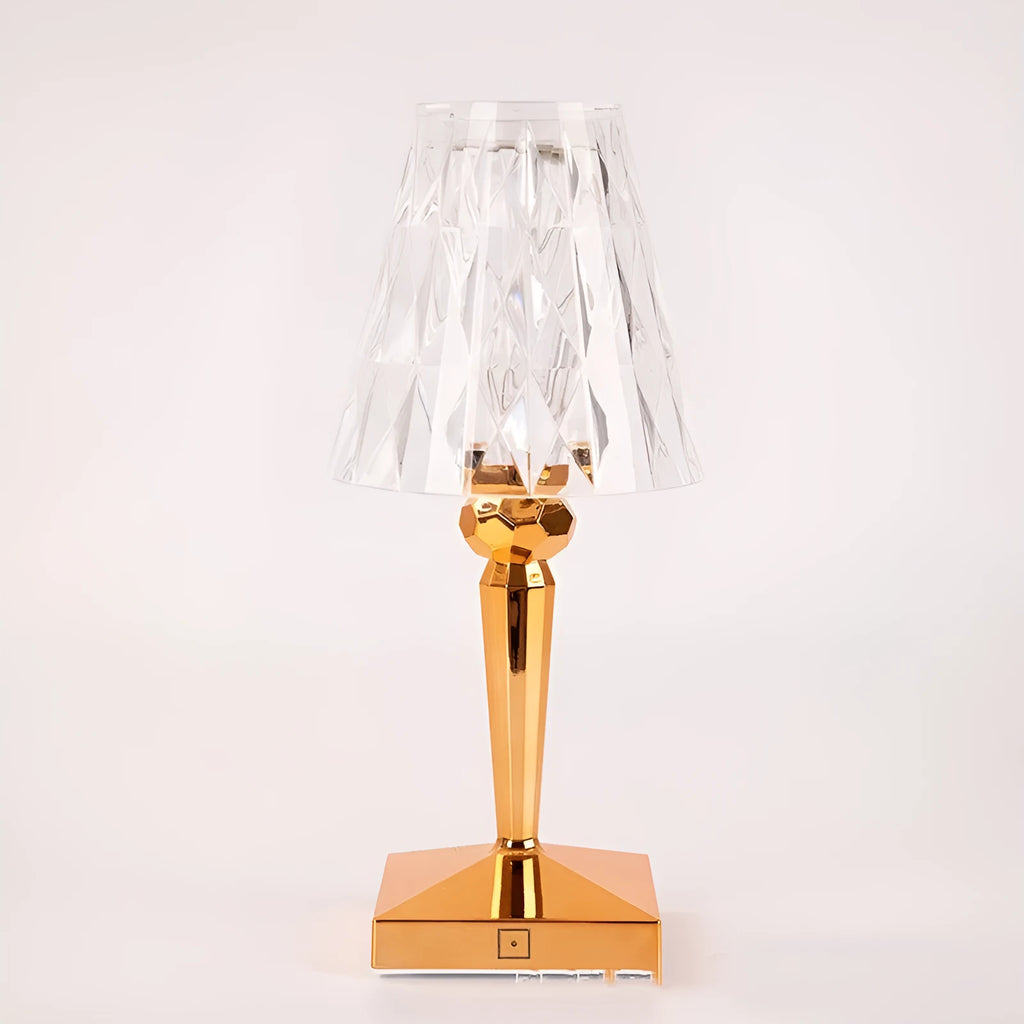 Rose gold portable touch night light with acrylic lamp holder on a surface