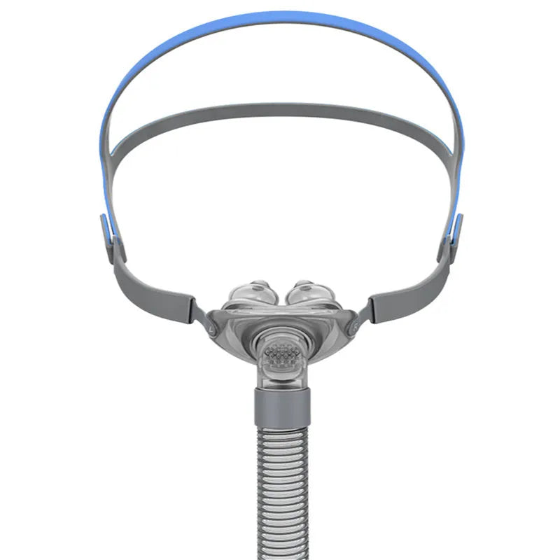 Ventilator nasal pillow mask kit with plastic frame, silicone nose cushion, and adjustable headband.