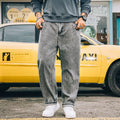 Men's loose fit straight leg jeans in cotton denim shown in dark blue, mid waist with zipper fly