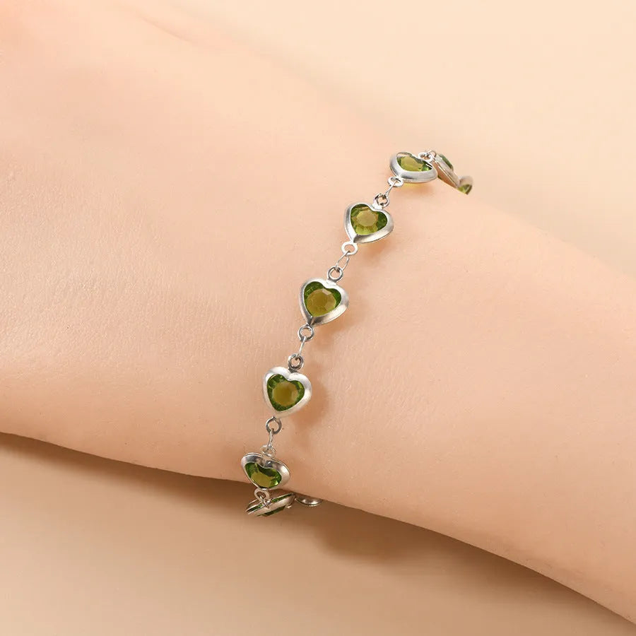 Geometric heart-shaped stainless steel bracelet with electroplated colourful finish on wrist